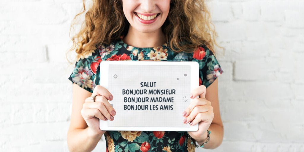 A French girl is holding a Tablet and showing phrases