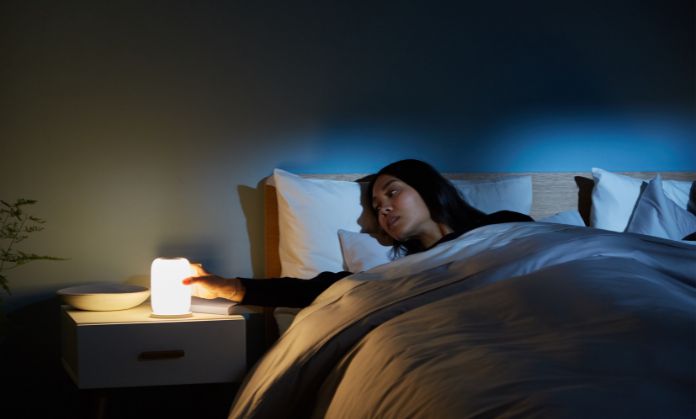 The girl is spending the night with the help of a light.