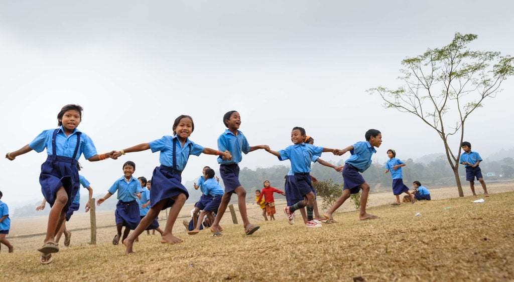 child running and playing together