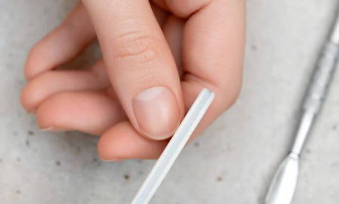 A girl Cleaning the nails