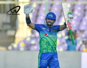 Muhammad Rizwan is holding a bat in his hand.