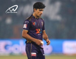 Naseem Shah is looking at the ground.