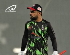 Rashid khan wearing black green shirt