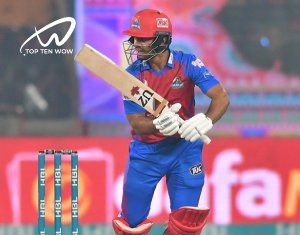 Qasim Akram wearing blue red sport kit