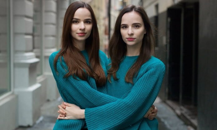 2 beautiful twins girls looking front