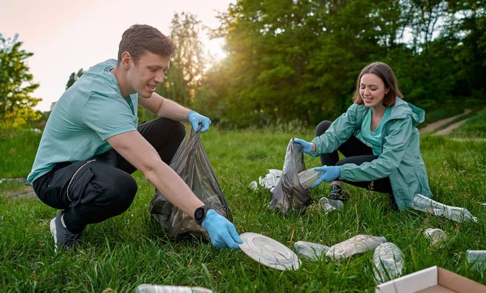 (world environment day) A boy and a girl clean the garden