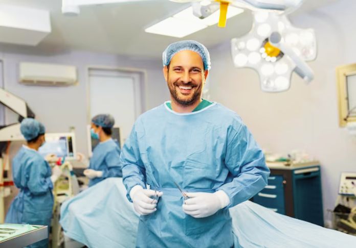 A plastic Surgeon in surgical gown.