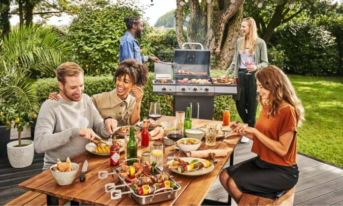 these people are eating a BBQ.