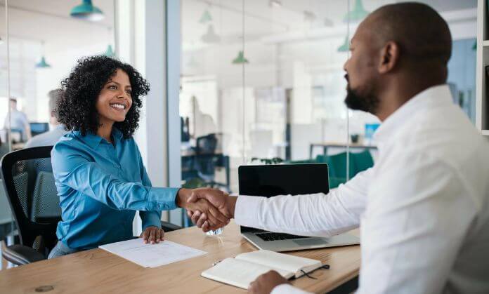 these dudes are shaking hands.