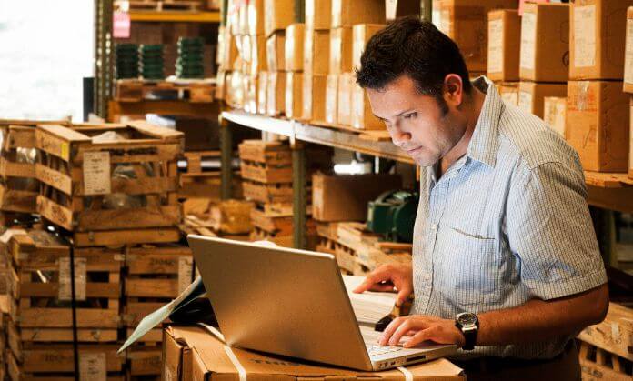 A man working on a laptop for his business.