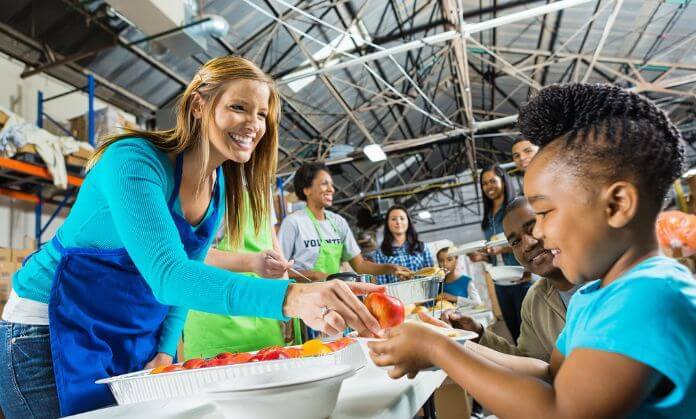 A woman serving a child.