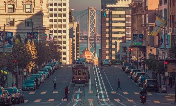 a cable car on a street in a city 