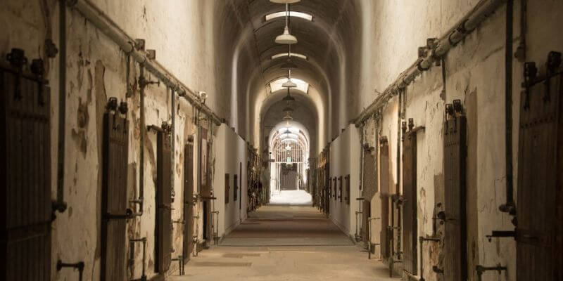 a long hallway with doors and a door