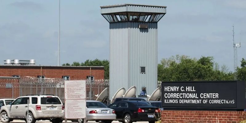 a tower with satellite dishes in the back 