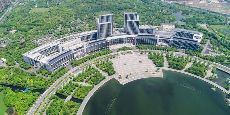 a large building with trees around it