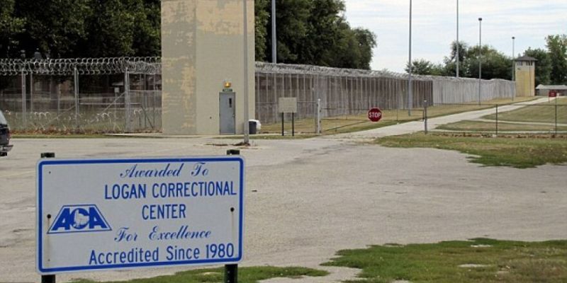 a sign on the road of logan correction center 