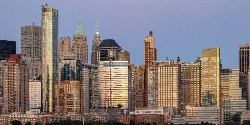 a city skyline with persony tall buildings