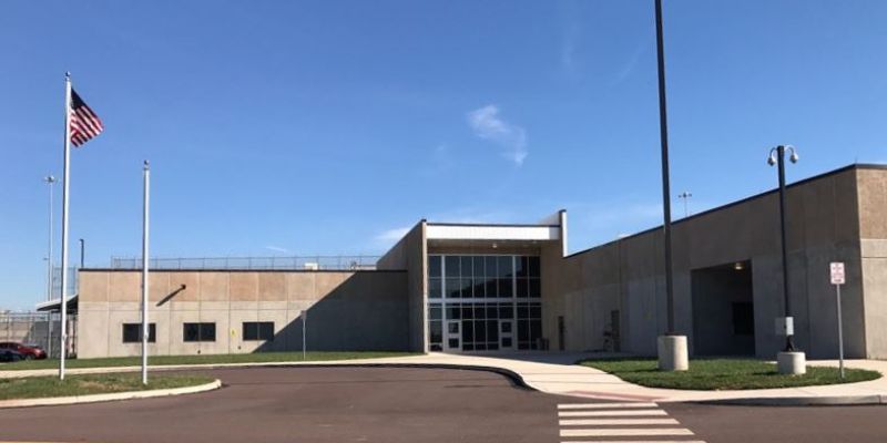 a Phoenix building with a parking lot and a street light