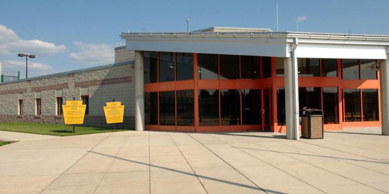 SCI Pine building with a glass door