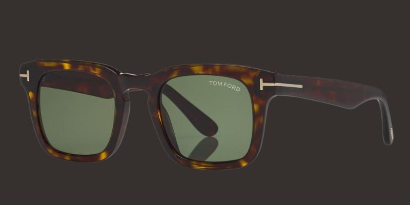 a pair of tom-ford sunglasses with green lenses