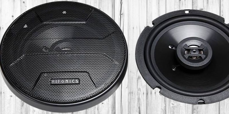 a black speaker with a round black speaker