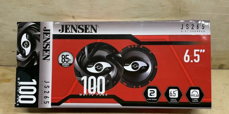 a box of speakers on a wood surface