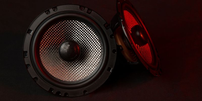 a pair of speakers with red lights