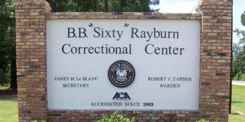 a sign on a brick wall