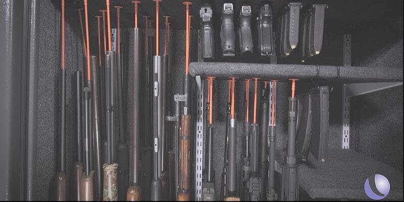 a gun rack with several guns 