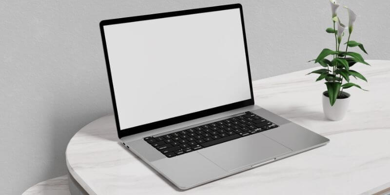 MAc Book on a marble table